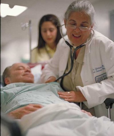 Dr. Goldstein with patient at Harborview. Photo Dennis Wise.