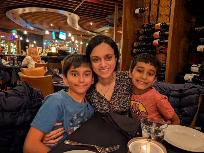 Radhika Narla with her children on each side