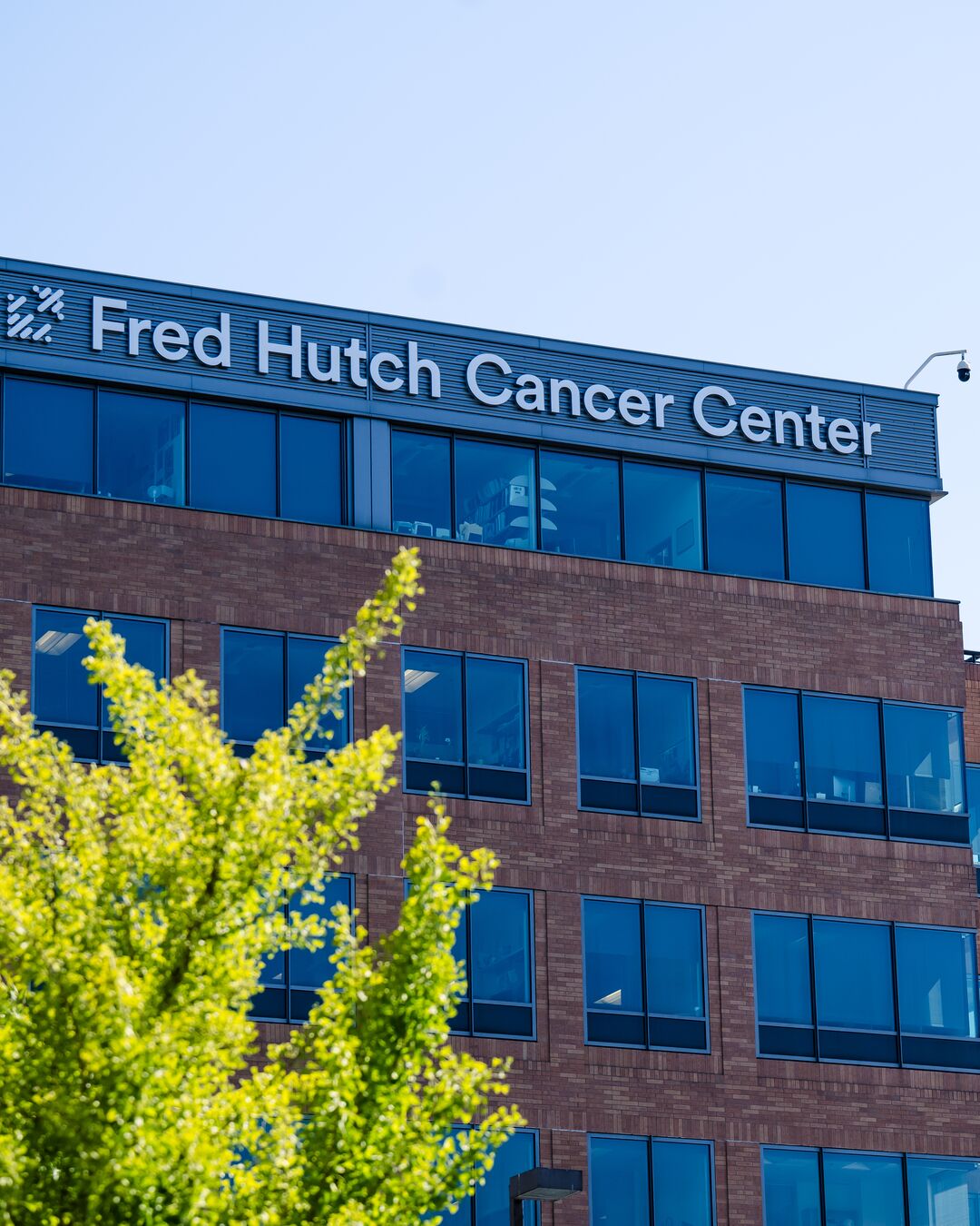 Exterior building reads "Fred Hutch Cancer Center"