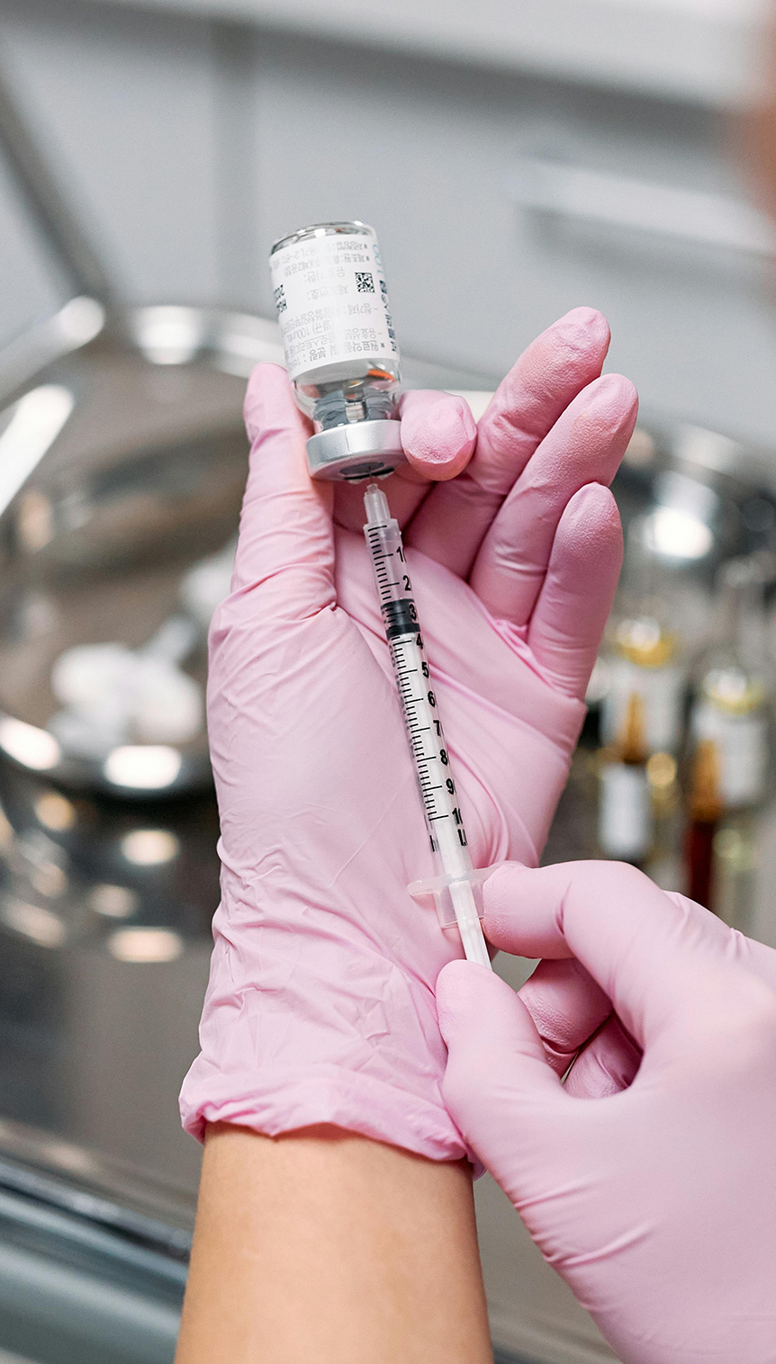 Doctor Inserting Syringe on an Ampoule 
