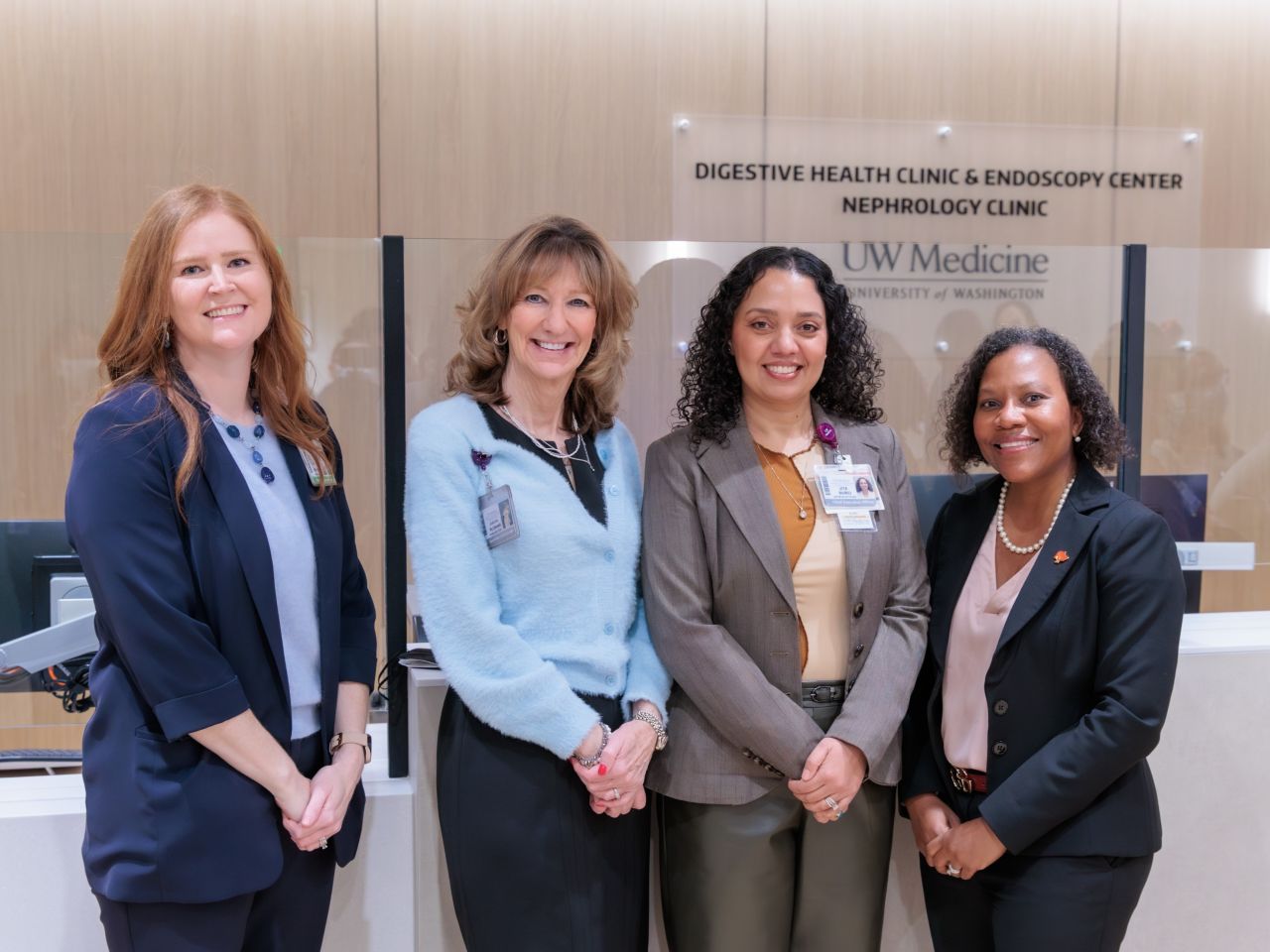 Dr. Rotonya Carr and clinic leadership in front of new clinic reception desk