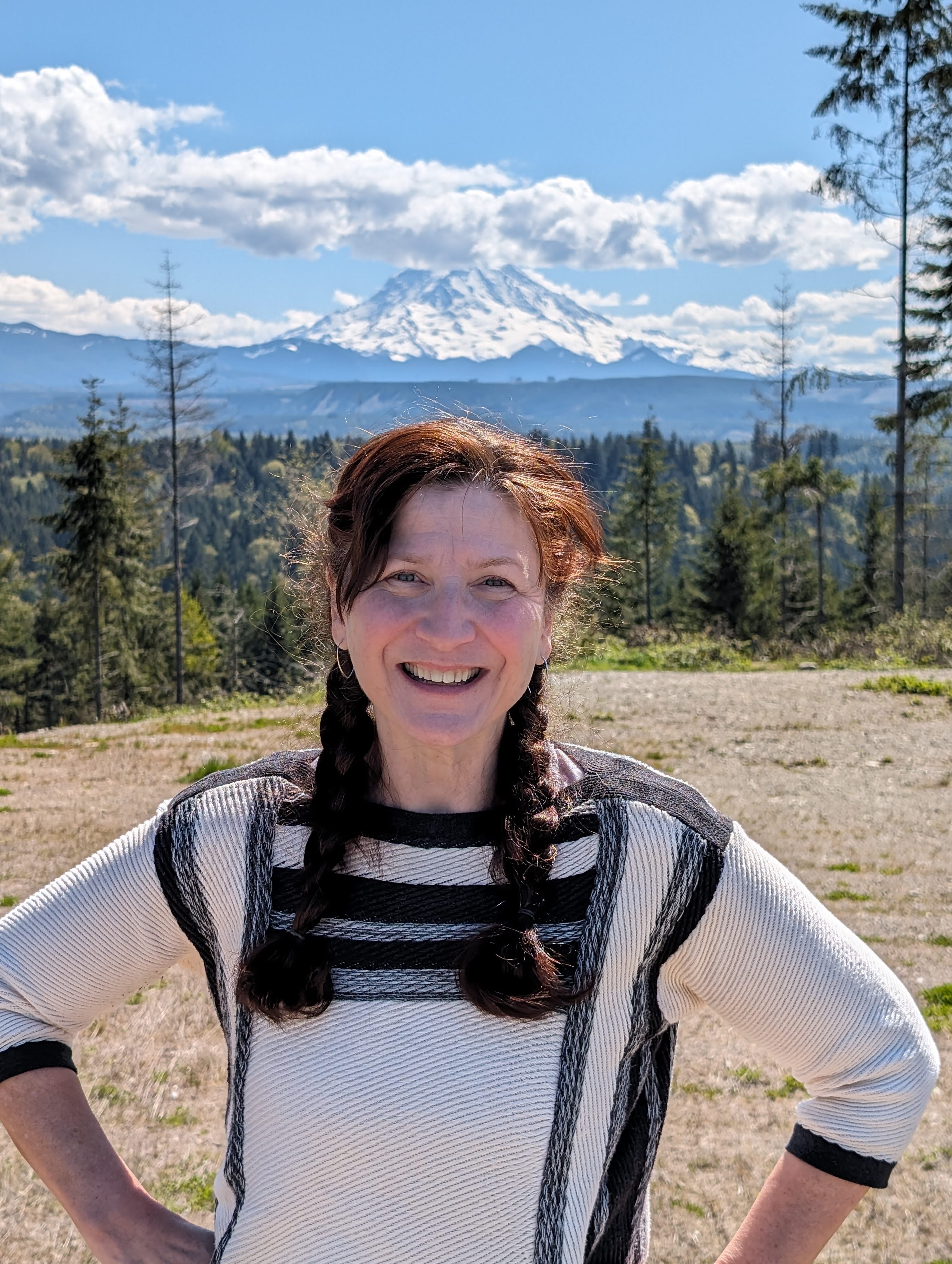 March Laden in front of trees and Mount Rainier in the background