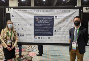 Assistant Professor Stefanie Deeds and Resident Terrence Liu stand in front of their poster at the 2022 SGIM Meeting
