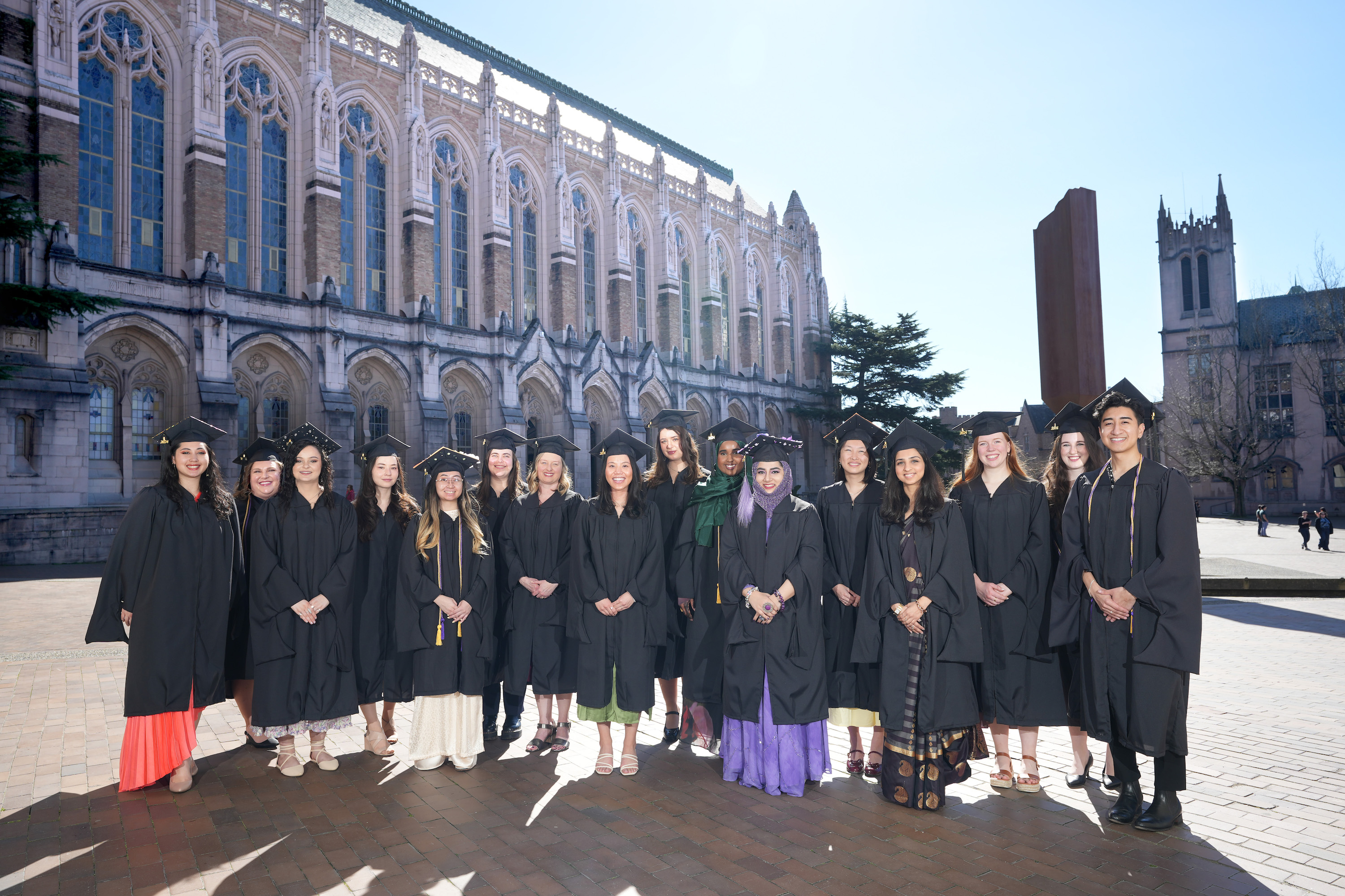 Genetic Counseling Graduate Program class of 2024 graduates. Students in graduation gowns in front of Suzallo Library on the UW Campus. 