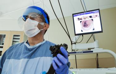 Doctor holding colonoscopy tool 