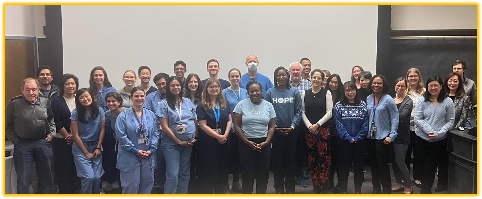 Group of gastroenterology employees wearing blue, 2024