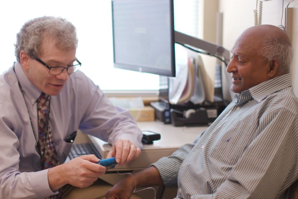 Dr. Irl Hirsch with a patient at the Diabetes Clinic