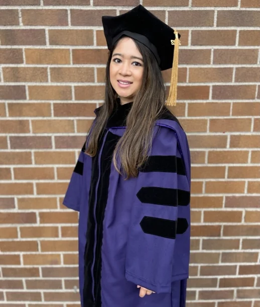 Marites in a graduation cap & gown