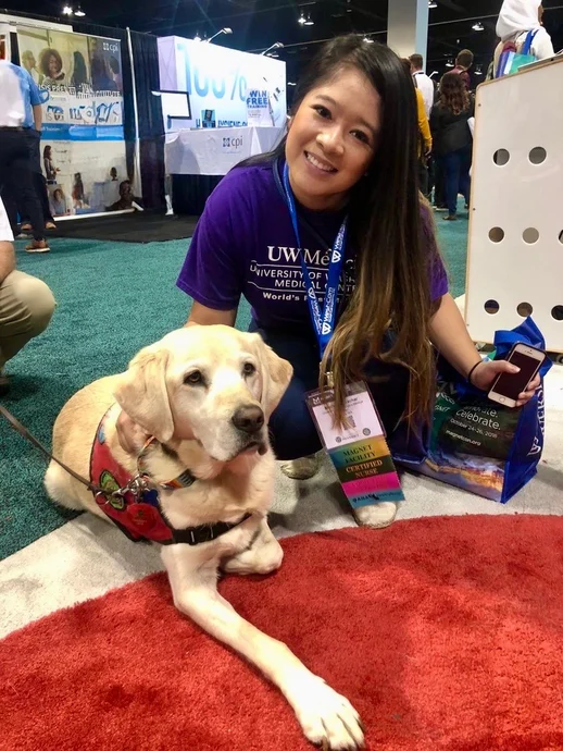 Marites with a service dog