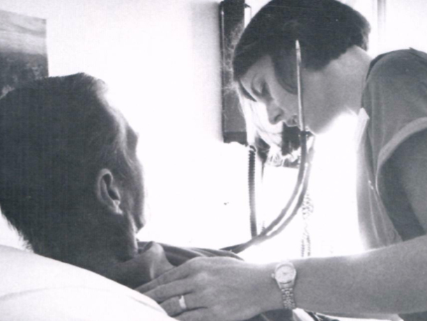 Doctor with AIDS patient. University of Washington