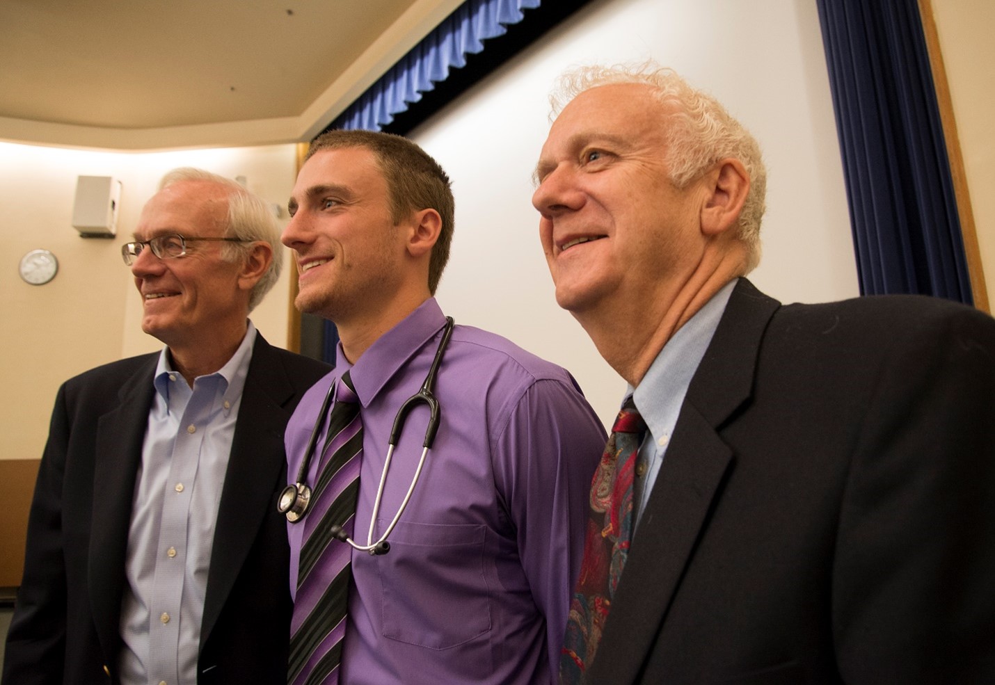 Richard Kirkpatrick (right) with his son Scott (current UW medical student) and his brother John at the stethoscope ceremony in 2014. Photo by Clare McLean/UW Medicine. 