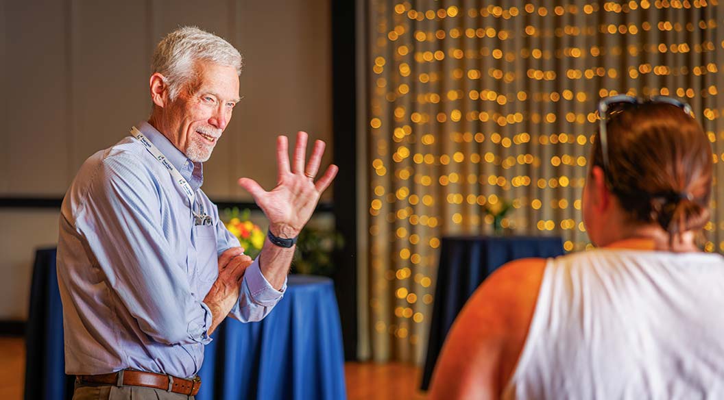 Dr. David Maloney waves goodbye to friends and colleagues during his retirement party in June. Maloney worked as the medical director of cellular immunotherapy at Fred Hutch and the Bezos Immunotherapy Clinic. Photo by Robert Hood / Fred Hutch News Service