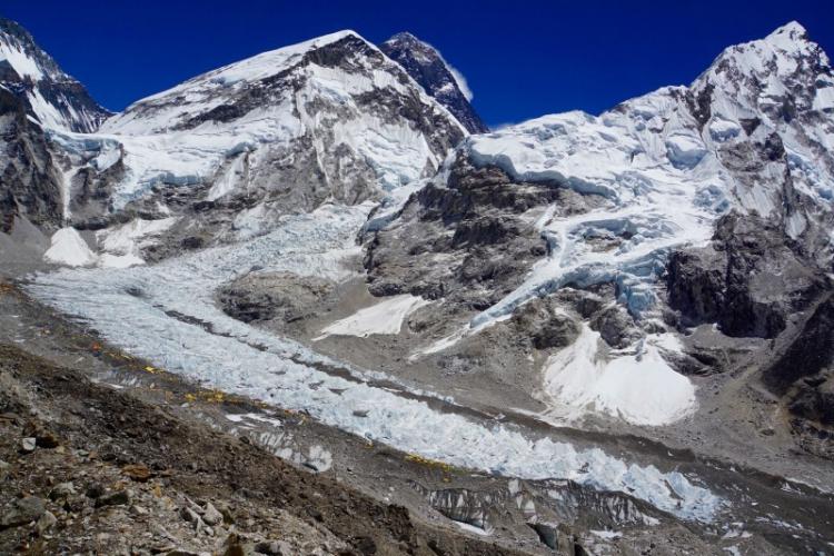 Mt. Everest looms like a dark tower above Nuptse, the Khumbu Glacier, and Base camp (photo: Paul Pottinger)