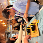 Student practicing biopsy on eggplants