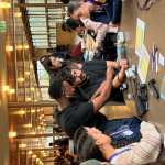 students practicing with blood pressure cuffs