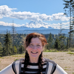 March Laden in front of trees and Mount Rainier in the background