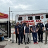Pop up staff in the park in front of mobile health van