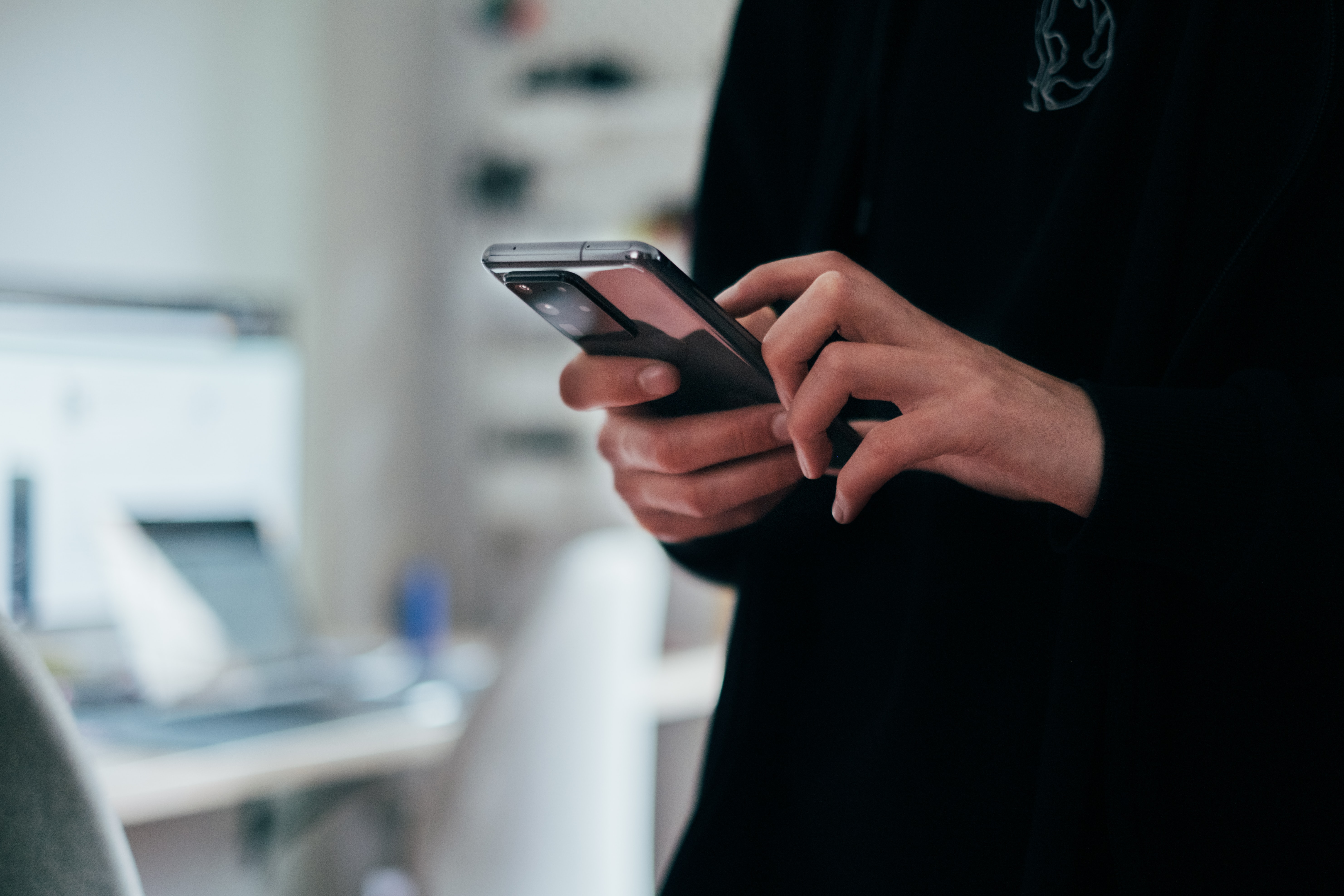 hands holding smartphone