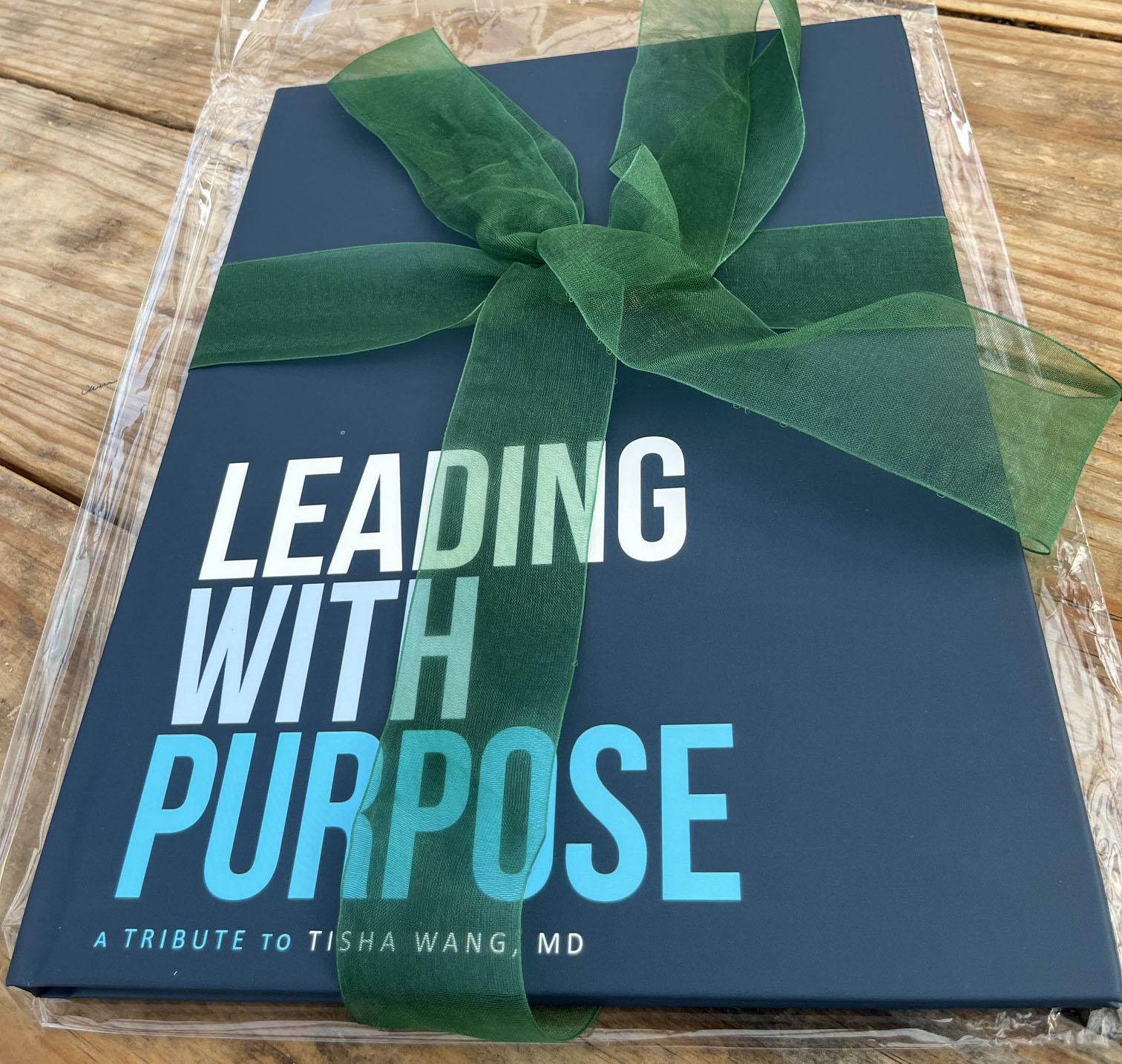 Book cover with the title "Leading with Purpose"