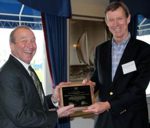 Dr. Oliver Press receiving the MSTP Alumnus Award from Dr. Paul Ramsey
