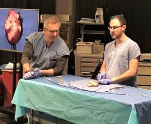 Mark Reisman and Dmitry Levin teaching the Kids in Medicine & Science Program